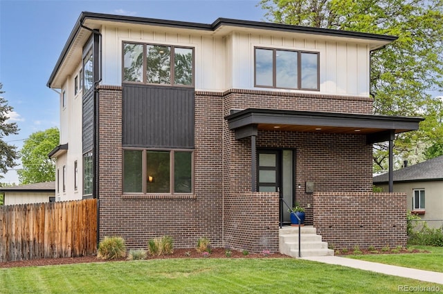 1373 S Garfield St, Denver, CO 80210 - view of front of property featuring brick siding and board and batten siding