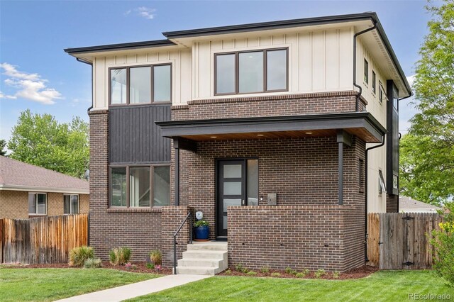 1373 S Garfield St, Denver, CO 80210 - view of front of property featuring brick siding and board and batten siding