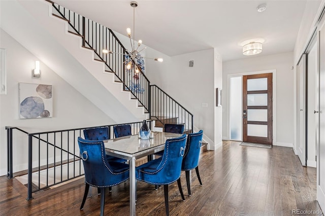1373 S Garfield St, Denver, CO 80210 - dining room featuring wood finished floors, a chandelier, stairway, and baseboards