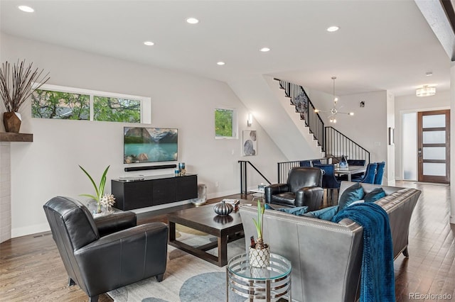 1373 S Garfield St, Denver, CO 80210 - living area featuring wood finished floors, plenty of natural light, stairs, recessed lighting, and baseboards