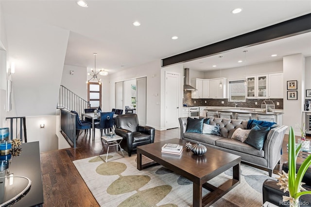 1373 S Garfield St, Denver, CO 80210 - living area with wood finished floors, recessed lighting, a chandelier, and stairway