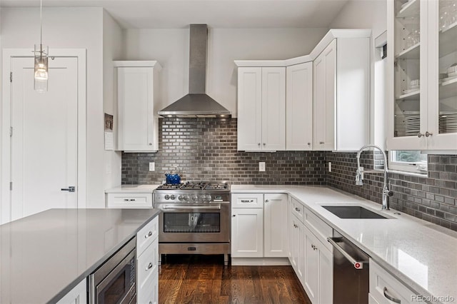 1373 S Garfield St, Denver, CO 80210 - kitchen featuring wall chimney exhaust hood, stainless steel appliances, a sink, and white cabinets