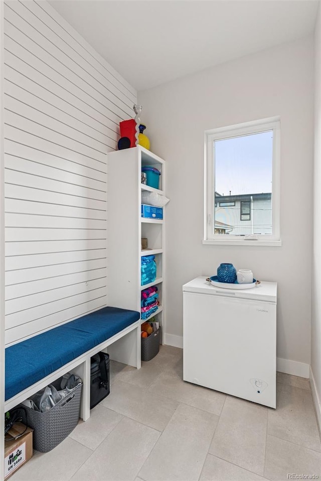 1373 S Garfield St, Denver, CO 80210 - mudroom with baseboards and wooden walls
