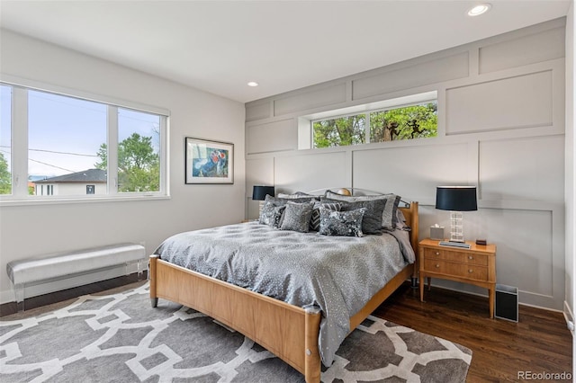 1373 S Garfield St, Denver, CO 80210 - bedroom featuring wood finished floors, a decorative wall, and recessed lighting