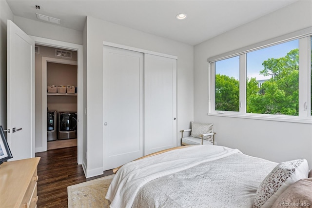 1373 S Garfield St, Denver, CO 80210 - bedroom featuring washing machine and dryer, multiple windows, dark wood-type flooring, recessed lighting, and a closet