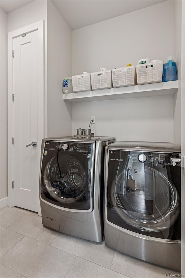 1373 S Garfield St, Denver, CO 80210 - laundry room featuring washing machine and clothes dryer and tile patterned flooring