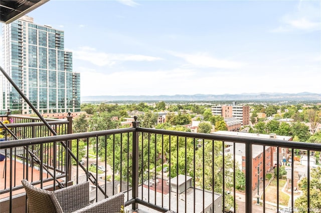 balcony with a city view and a mountain view