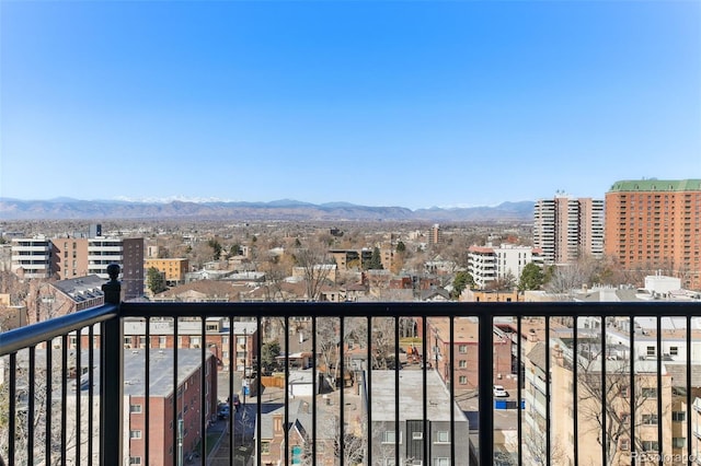 balcony with a view of city and a mountain view