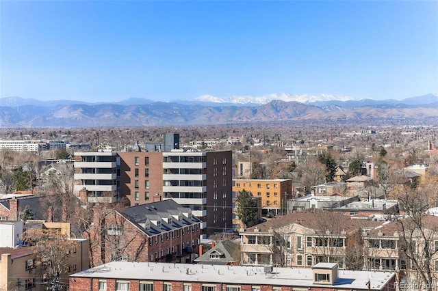 property's view of city featuring a mountain view