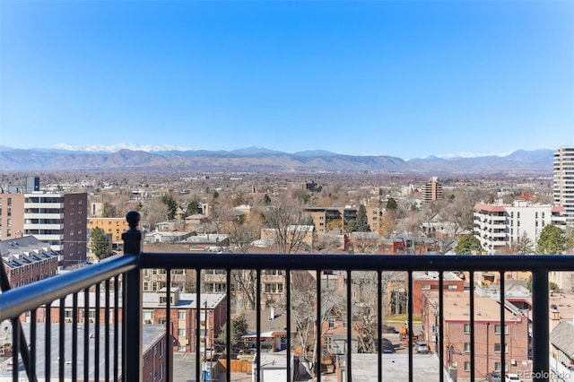 balcony with a city view and a mountain view