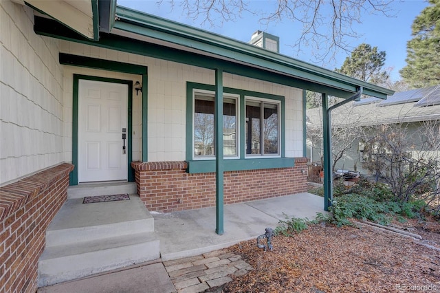 entrance to property featuring a porch