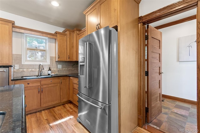 3039 W 22nd Ave, Denver, CO 80211 - kitchen featuring high end refrigerator, decorative backsplash, dark stone countertops, and recessed lighting