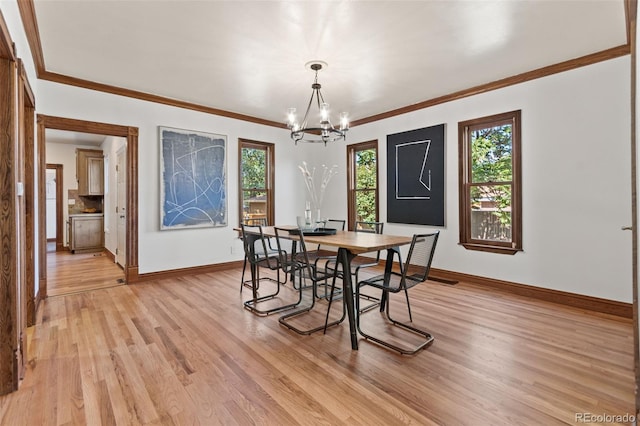 3039 W 22nd Ave, Denver, CO 80211 - dining area with a chandelier, light wood finished floors, and crown molding