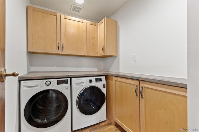 3039 W 22nd Ave, Denver, CO 80211 - laundry area with washing machine and dryer, cabinet space, and light wood-style flooring