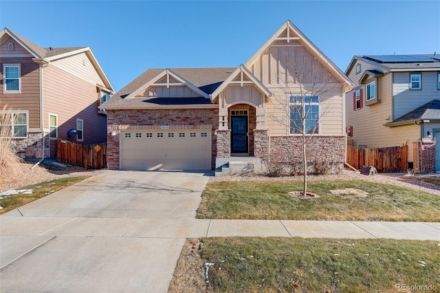 view of front of home with a garage and a front yard