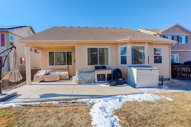 rear view of property featuring a yard and a patio