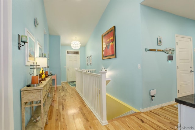 corridor with light hardwood / wood-style floors