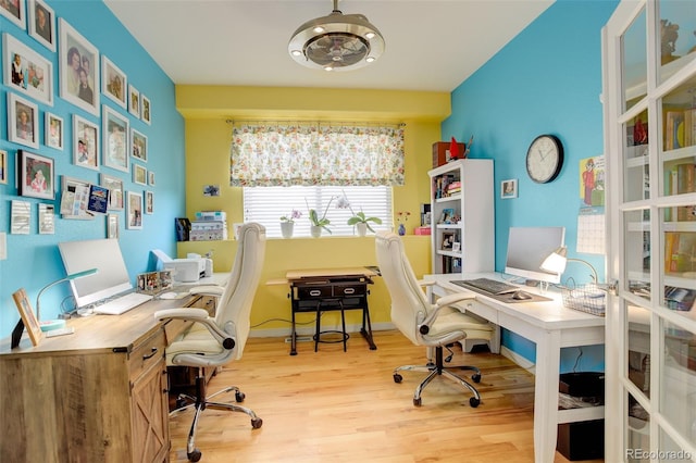 office with light wood-type flooring