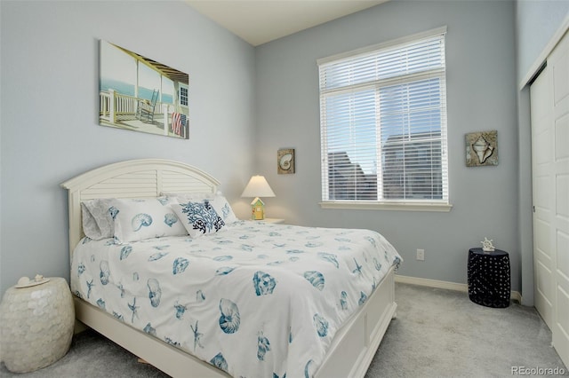 carpeted bedroom featuring a closet