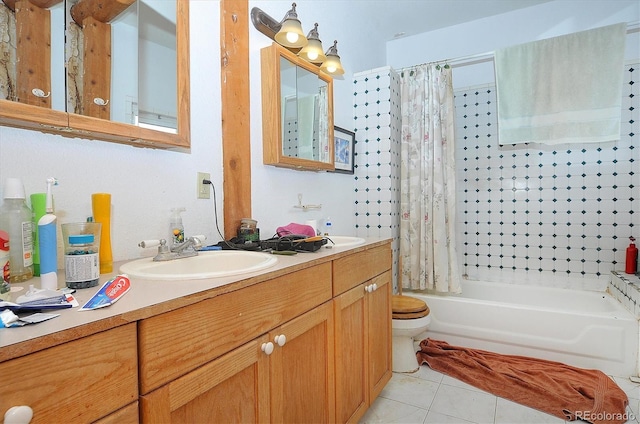 full bathroom featuring tile patterned flooring, vanity, toilet, and shower / tub combo with curtain