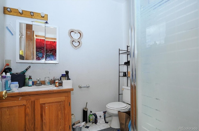 bathroom with toilet and vanity