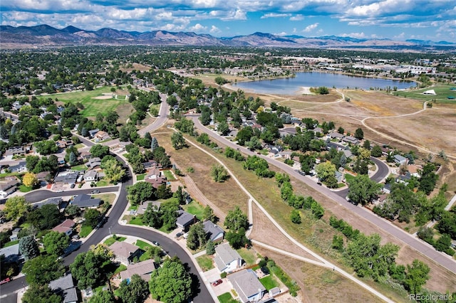 bird's eye view with a water and mountain view