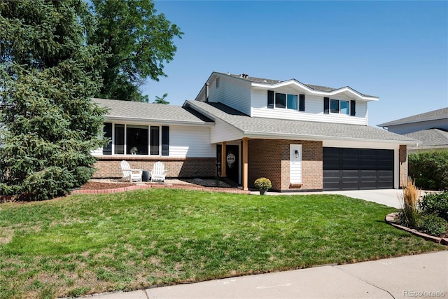 tri-level home with a front yard and a garage