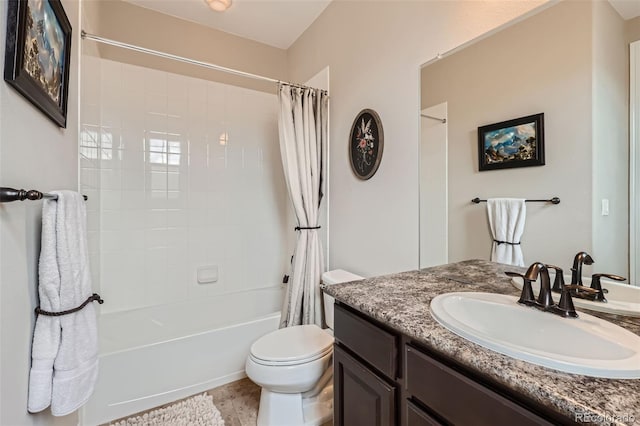 full bath with shower / bath combo, vanity, and toilet