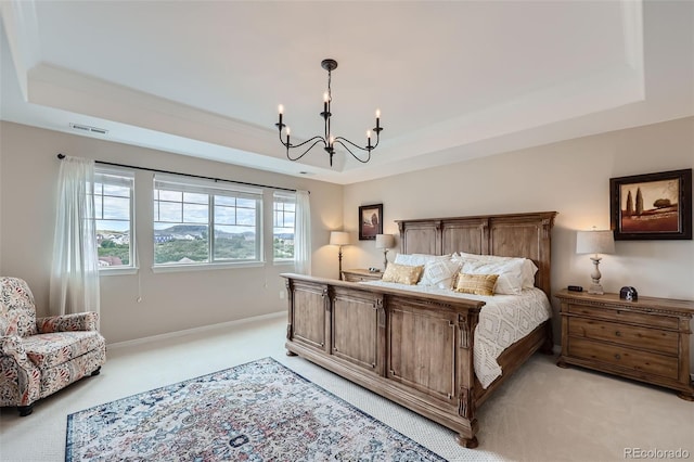 bedroom with a tray ceiling, visible vents, light carpet, a chandelier, and baseboards