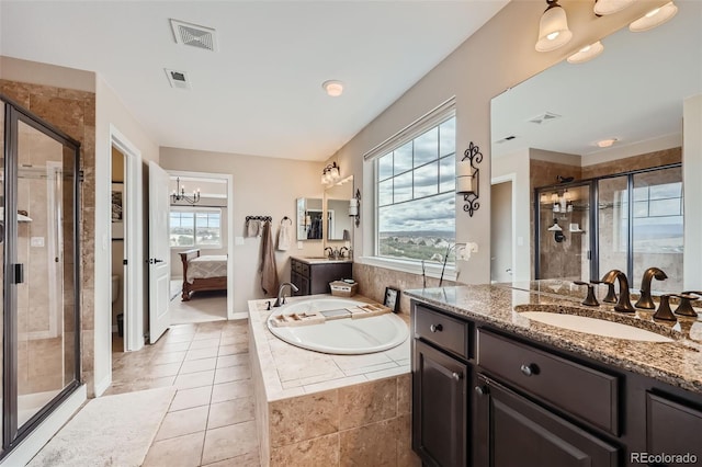 bathroom featuring a sink, visible vents, a healthy amount of sunlight, a bath, and a stall shower