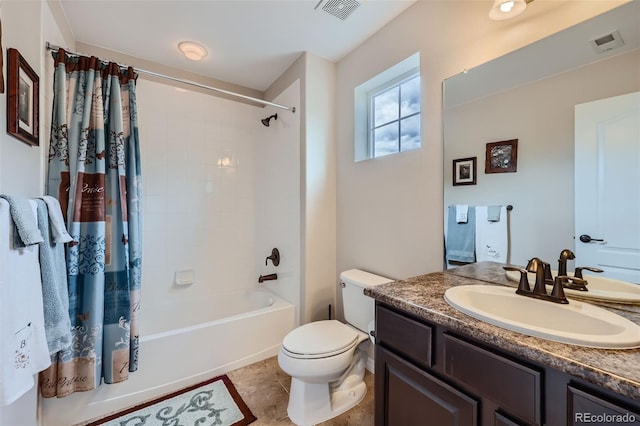 bathroom featuring toilet, vanity, visible vents, and shower / bathtub combination with curtain