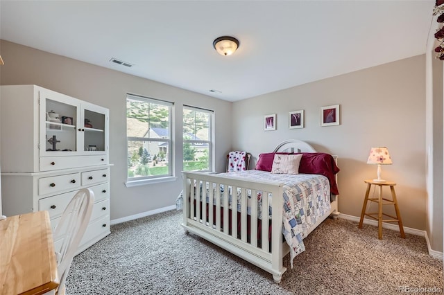 bedroom featuring baseboards, visible vents, and carpet flooring