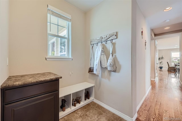 mudroom with baseboards and recessed lighting