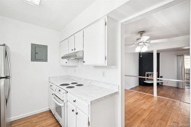 kitchen with white range with electric stovetop, white cabinetry, light hardwood / wood-style flooring, electric panel, and stainless steel refrigerator