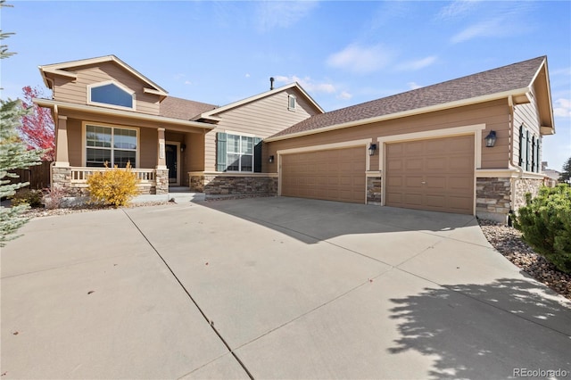 craftsman house with a porch and a garage