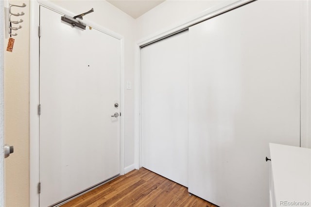 doorway to outside with light wood finished floors