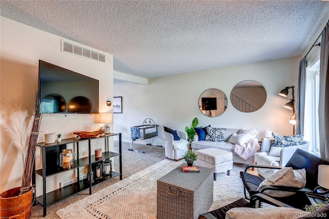 3572 S Kittredge St Unit B, Aurora, CO 80013 - carpeted living room featuring a textured ceiling and healthy amount of natural light