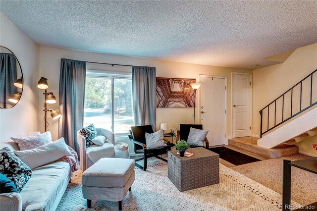 3572 S Kittredge St Unit B, Aurora, CO 80013 - living area featuring stairway and a textured ceiling