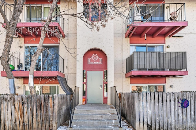 entrance to property featuring a balcony