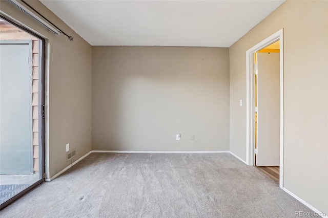 empty room featuring light colored carpet