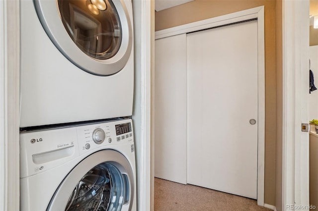 laundry area featuring stacked washer and dryer