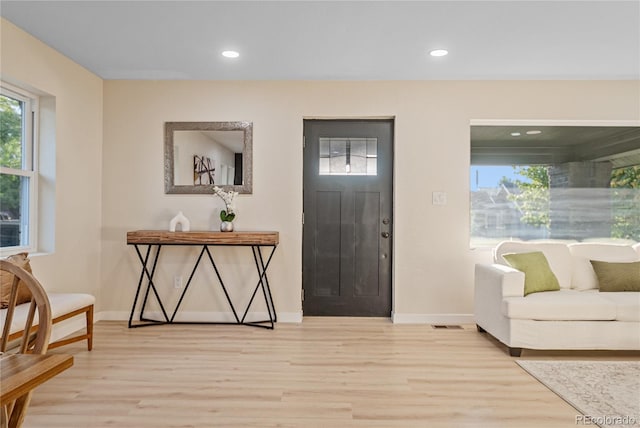 entryway with hardwood / wood-style flooring