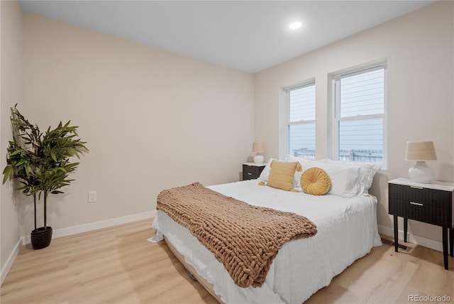 bedroom with light hardwood / wood-style floors