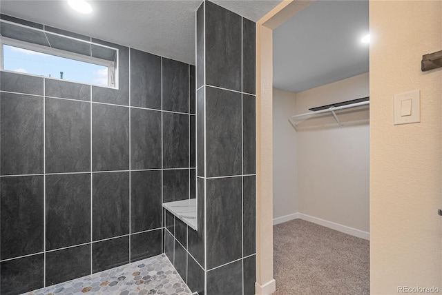 bathroom with tiled shower