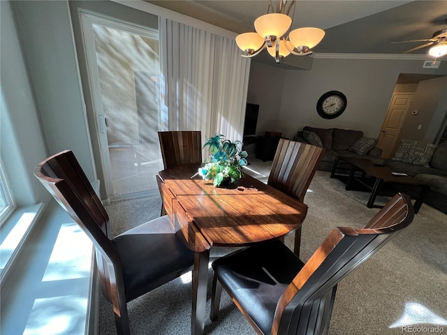 dining room with ceiling fan with notable chandelier and crown molding