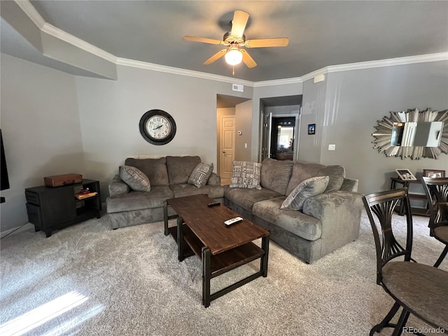 carpeted living room with ceiling fan and crown molding