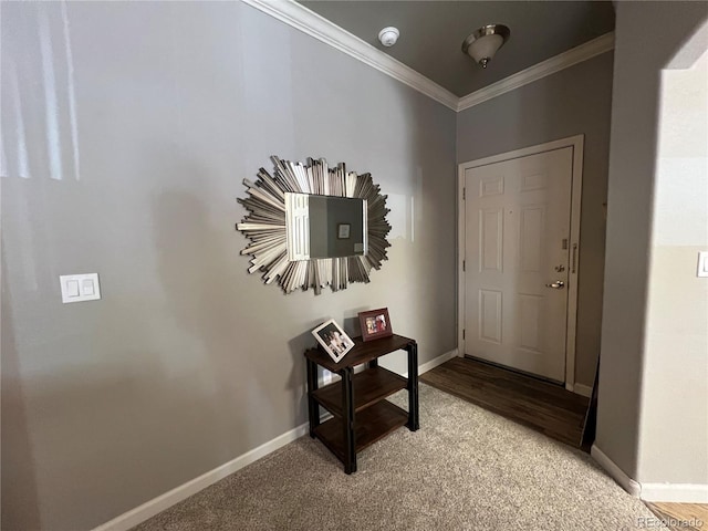 carpeted foyer entrance featuring crown molding