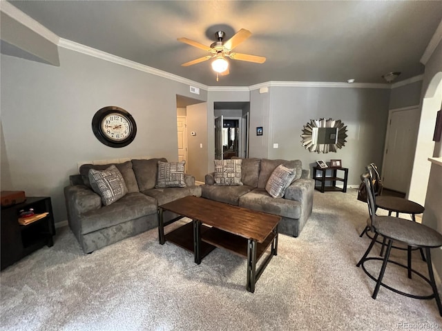 carpeted living room featuring ceiling fan and crown molding