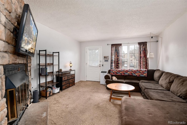 14272 E Hawaii Cir Unit B, Aurora, CO 80012 - living room with a fireplace, carpet flooring, and a textured ceiling