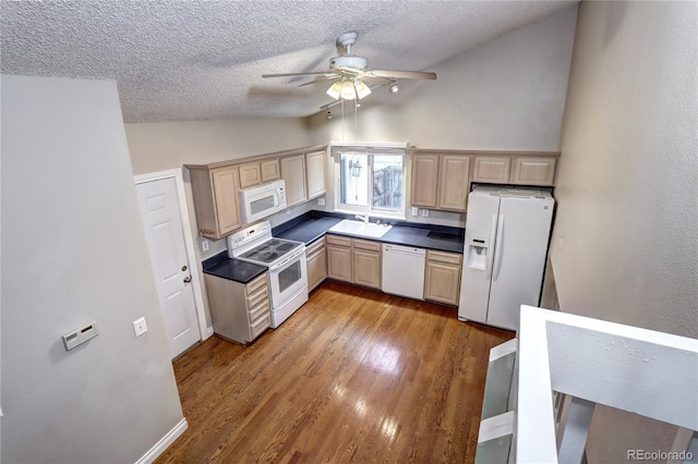 kitchen with lofted ceiling, hardwood / wood-style floors, sink, light brown cabinets, and white appliances